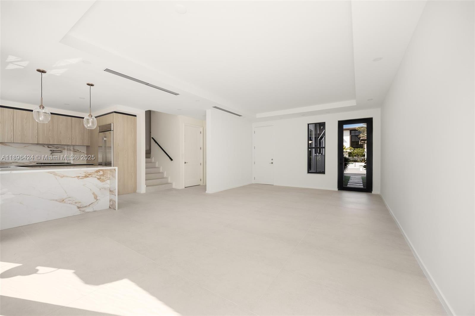 7498 Southwest 100th Street, Unit 8 Pinecrest, FL 33156 - Photo 5 of 61 a view of a kitchen with refrigerator and more cabinets