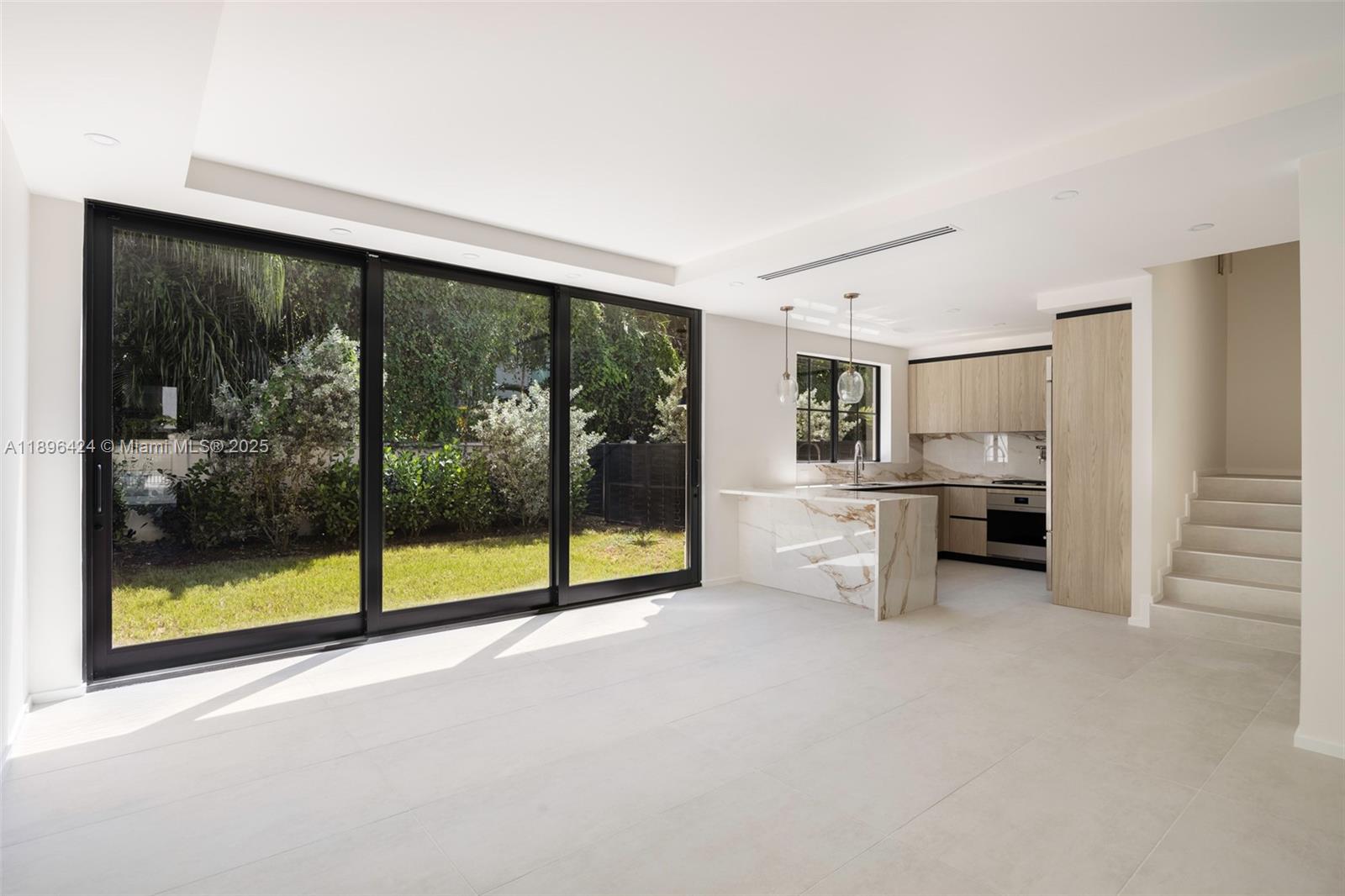 7498 Southwest 100th Street, Unit 8 Pinecrest, FL 33156 - Photo 6 of 61 a view of a big room with an empty room and kitchen