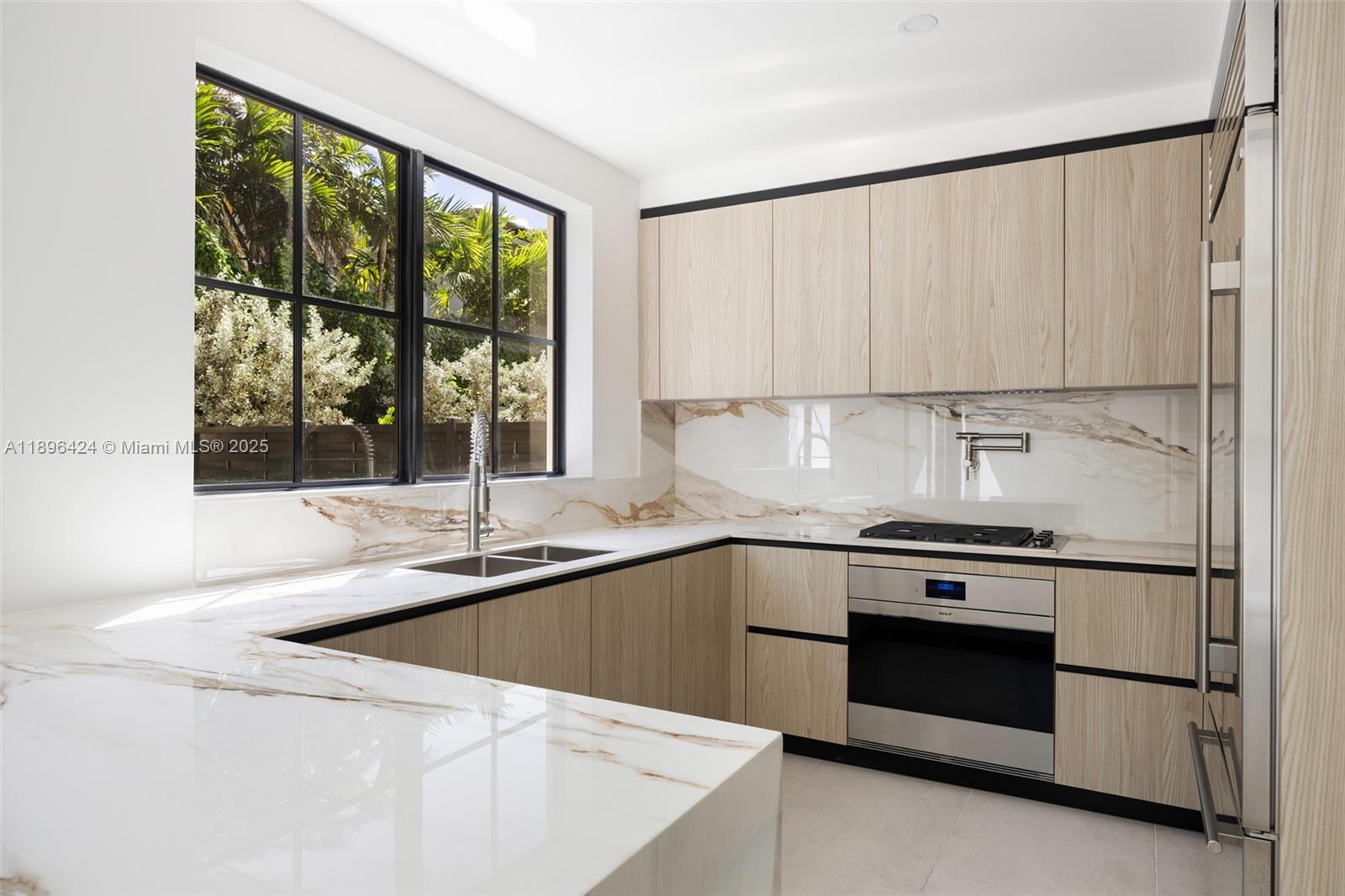 7498 Southwest 100th Street, Unit 8 Pinecrest, FL 33156 - Photo 10 of 61 a kitchen with a stove a sink and a window