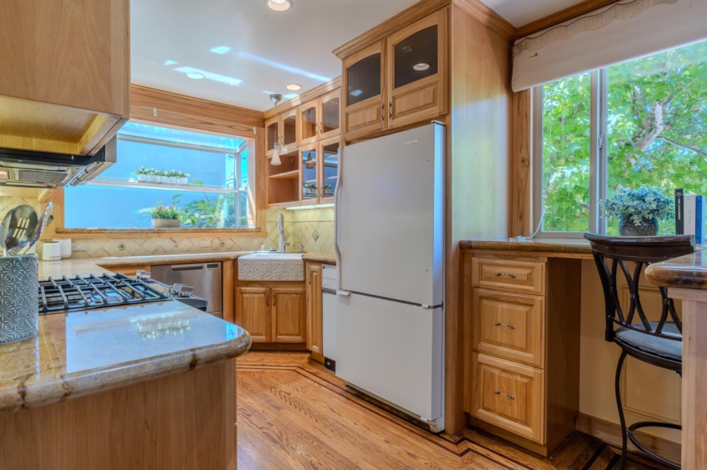 67 Cliffside Drive Daly City, CA 94015 - Photo 11 of 37 a kitchen with a refrigerator and a stove top oven