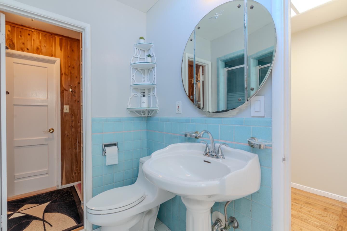 67 Cliffside Drive Daly City, CA 94015 - Photo 21 of 37 a bathroom with a toilet sink and mirror