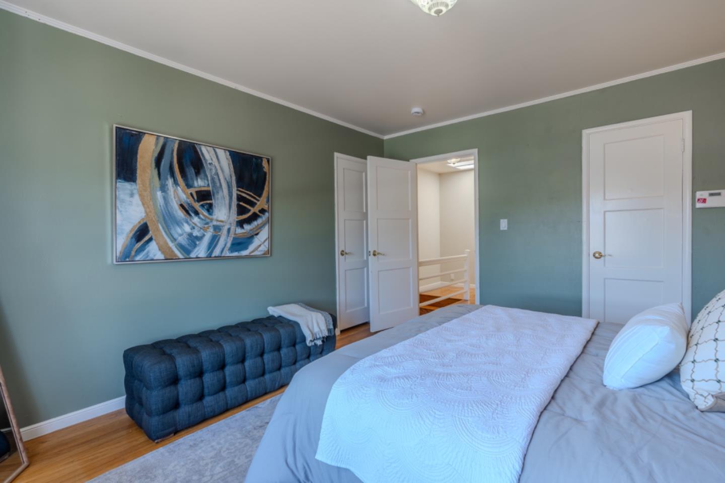 67 Cliffside Drive Daly City, CA 94015 - Photo 23 of 37 a bedroom with a bed and painting on the wall
