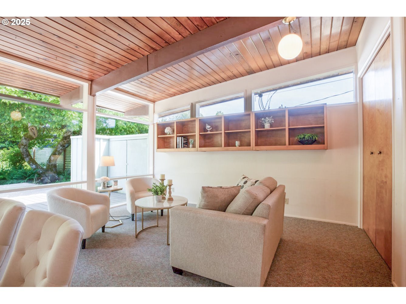 1439 Barton Street Eugene, OR 97404 - Photo 12 of 30 a living room with furniture a wooden floor and next to a window