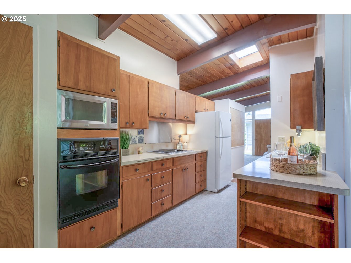 1439 Barton Street Eugene, OR 97404 - Photo 16 of 30 a kitchen with stainless steel appliances granite countertop a stove a sink and a microwave