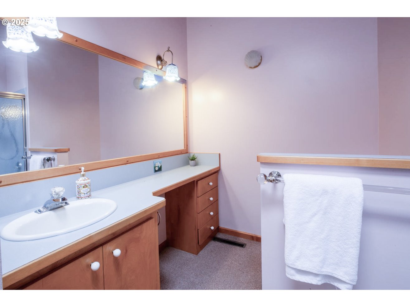 1439 Barton Street Eugene, OR 97404 - Photo 23 of 30 a bathroom with a sink vanity tub and shower