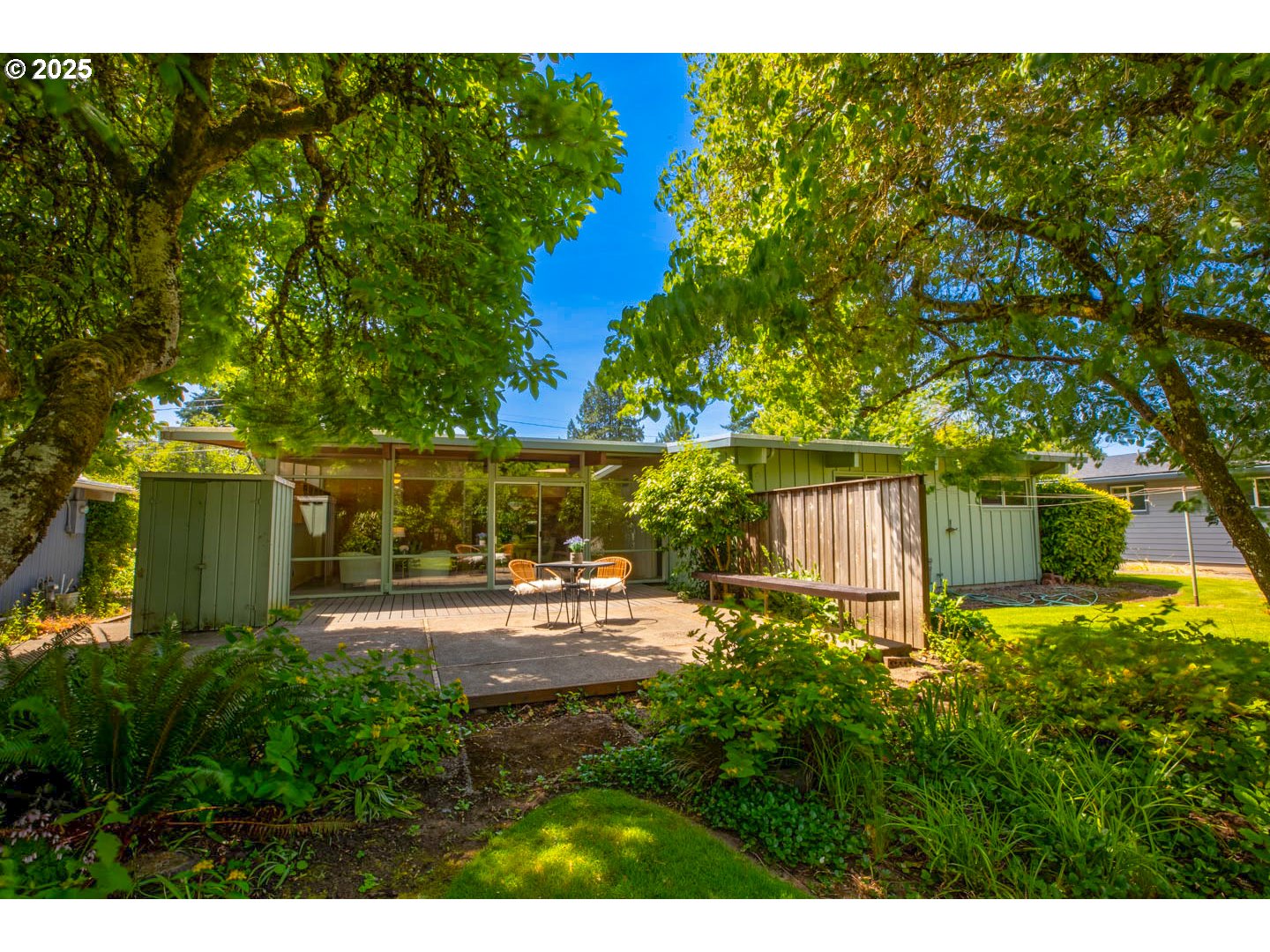1439 Barton Street Eugene, OR 97404 - Photo 27 of 30 a view of backyard with plants and trees
