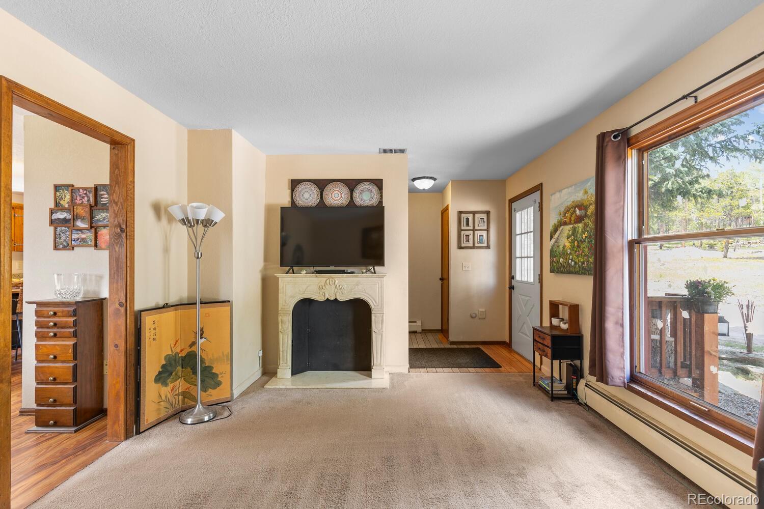 8600 South Warhawk Road Conifer, CO 80433 - Photo 15 of 50 a view of an empty room with large windows