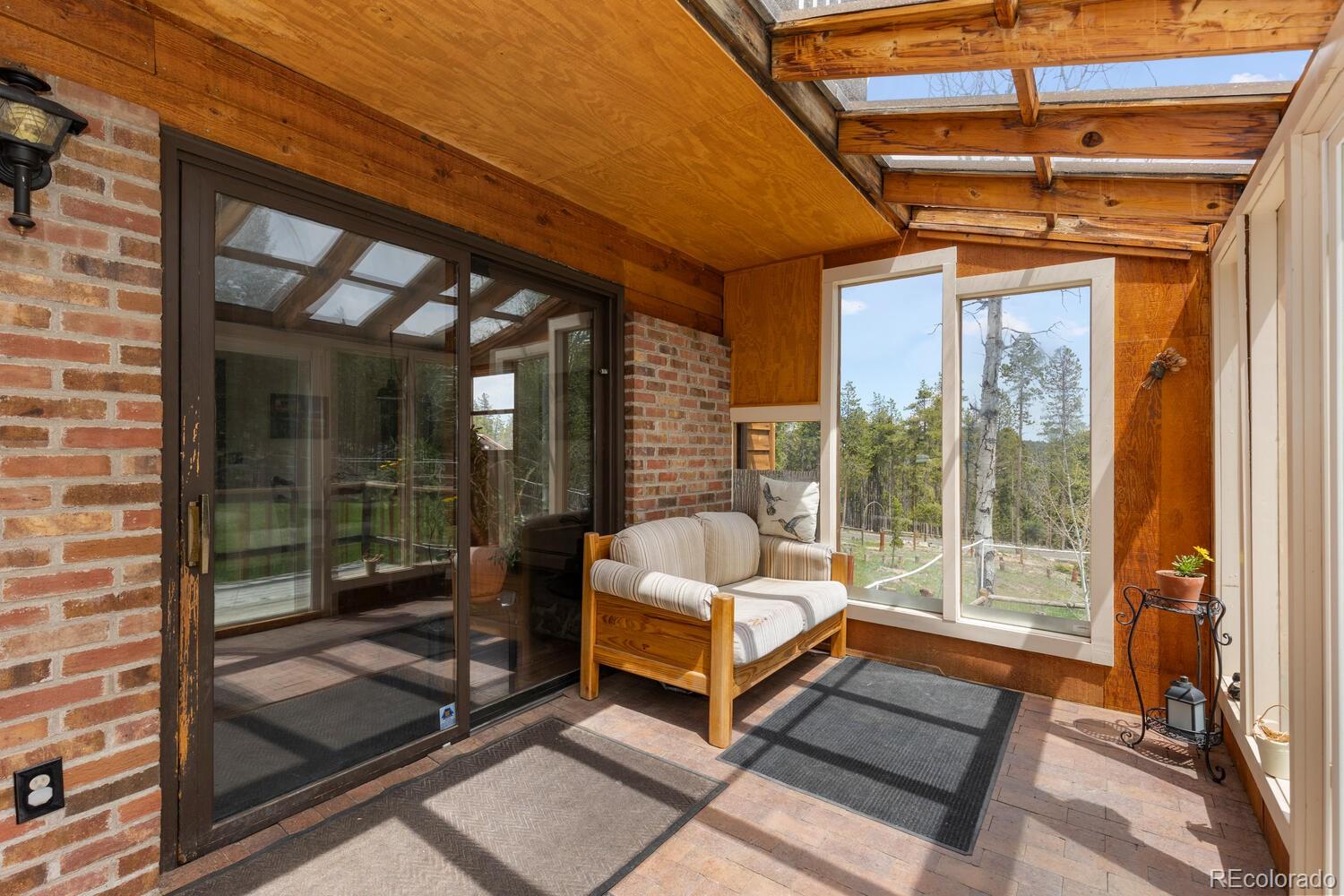 8600 South Warhawk Road Conifer, CO 80433 - Photo 18 of 50 a building outdoor space with seating area