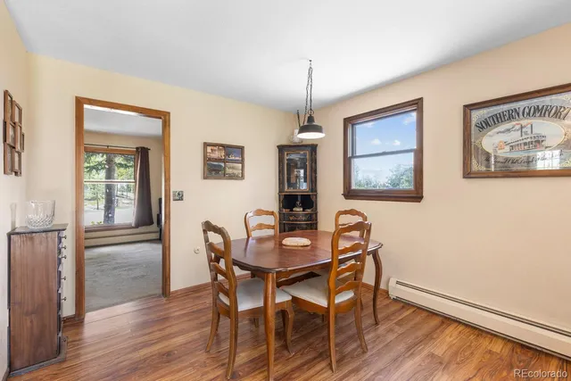 a dining room with furniture and window
