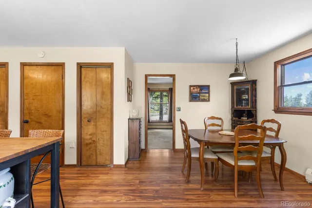 a dining room with furniture window wooden floor