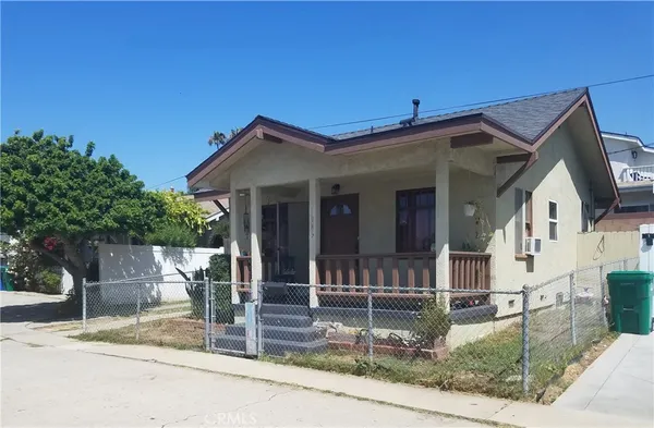 a front view of a house with garage