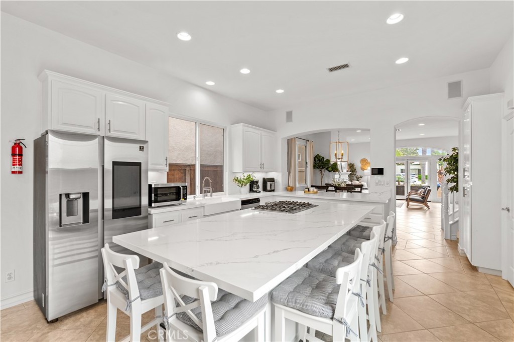 513 Pecan Avenue Huntington Beach, CA 92648 - Photo 13 of 46 a large kitchen with a large counter top appliances and cabinets