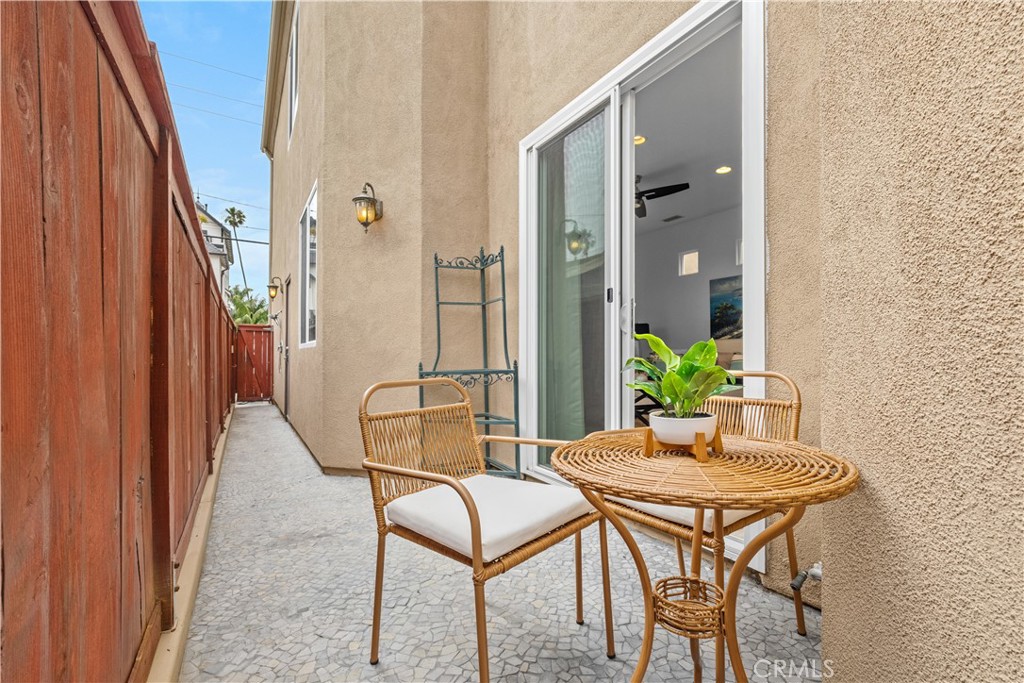 513 Pecan Avenue Huntington Beach, CA 92648 - Photo 18 of 46 a dining room with furniture and wooden floor