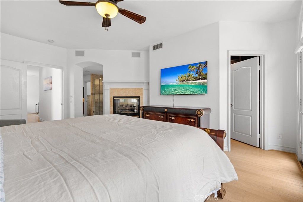 513 Pecan Avenue Huntington Beach, CA 92648 - Photo 25 of 46 a bedroom with a bed and a flat screen tv