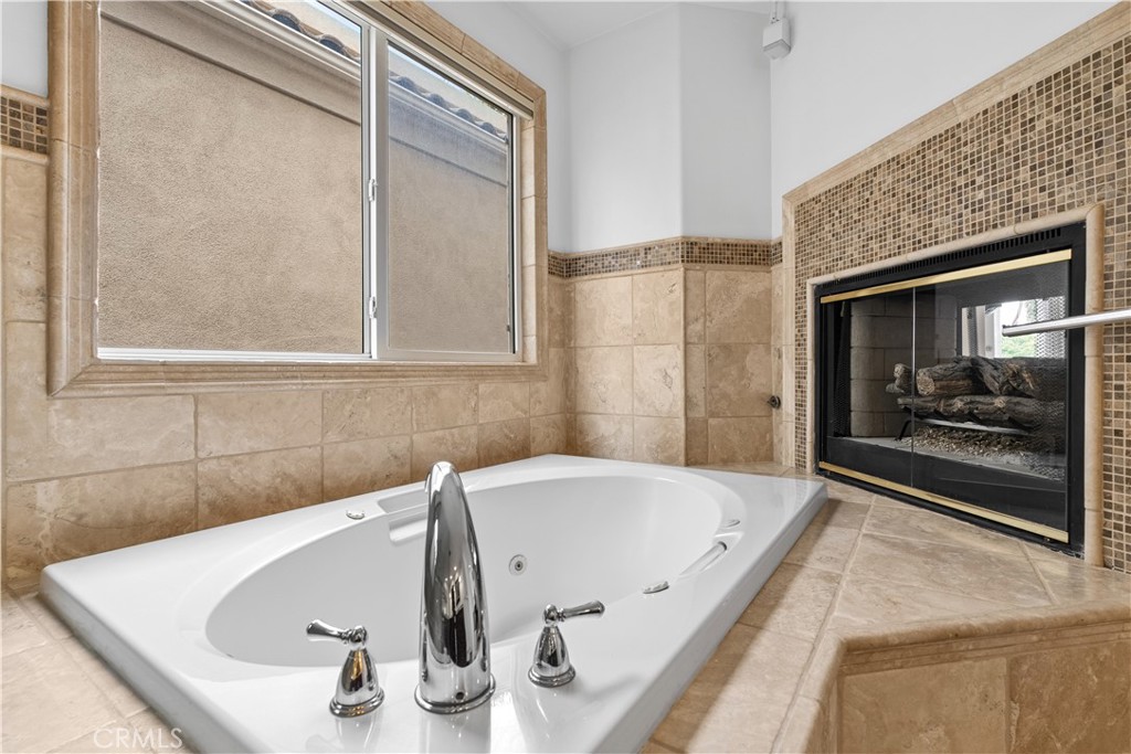 513 Pecan Avenue Huntington Beach, CA 92648 - Photo 29 of 46 a bathroom with a tub and shower