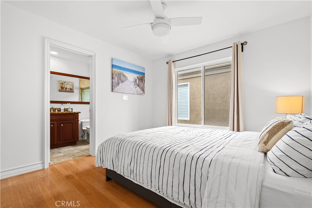 513 Pecan Avenue Huntington Beach, CA 92648 - Photo 33 of 46 a bedroom with a bed and a window