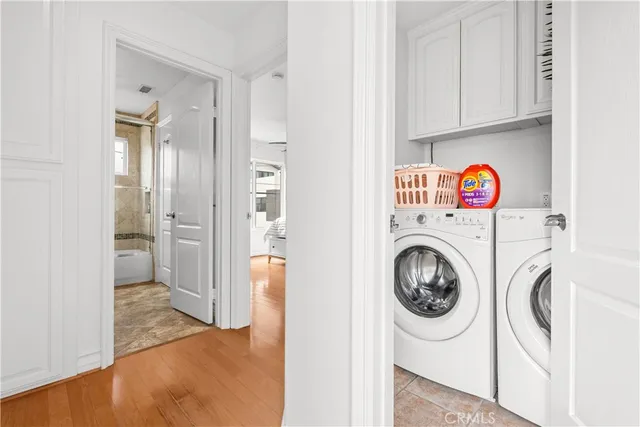 a view of a hallway with washer and dryer