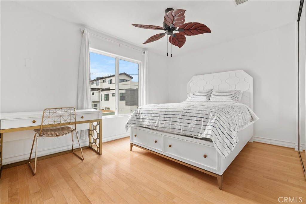 513 Pecan Avenue Huntington Beach, CA 92648 - Photo 35 of 46 a bedroom with a bed and a desk