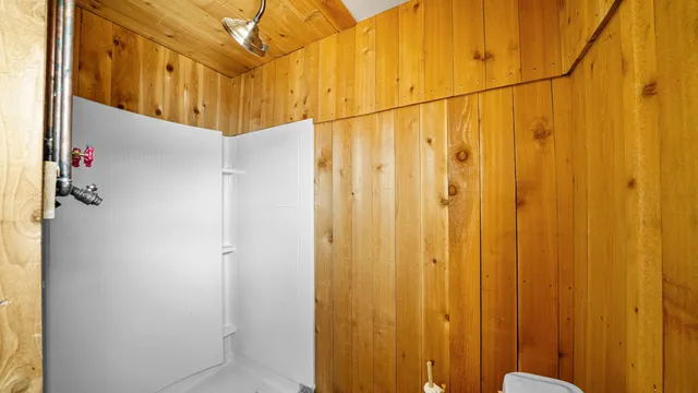 a view of a room with wooden floor and staircase