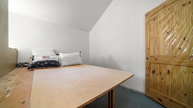 a view of livingroom with furniture and gym equipment