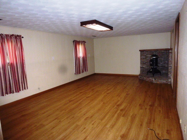 1026 Highway 10 Clinton, IL 61727 - Photo 11 of 20 wooden floor in an empty room with a window
