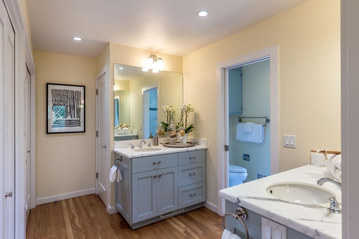 166 Sausal Drive Portola Valley, CA 94028 - Photo 15 of 26 a en suite bathroom with a granite countertop sink and a mirror