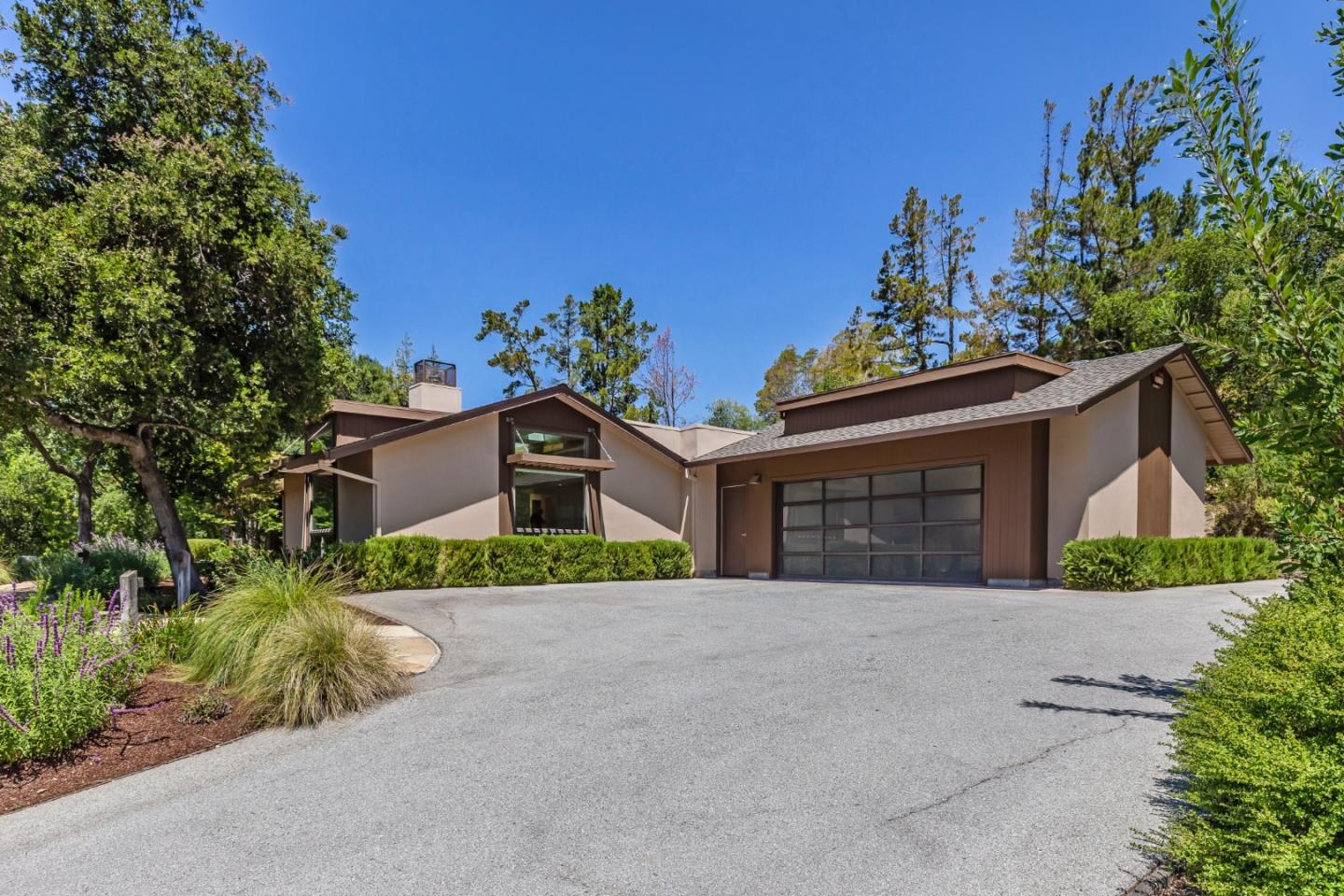 166 Sausal Drive Portola Valley, CA 94028 - Photo 2 of 26 a front view of a house with a yard and garage
