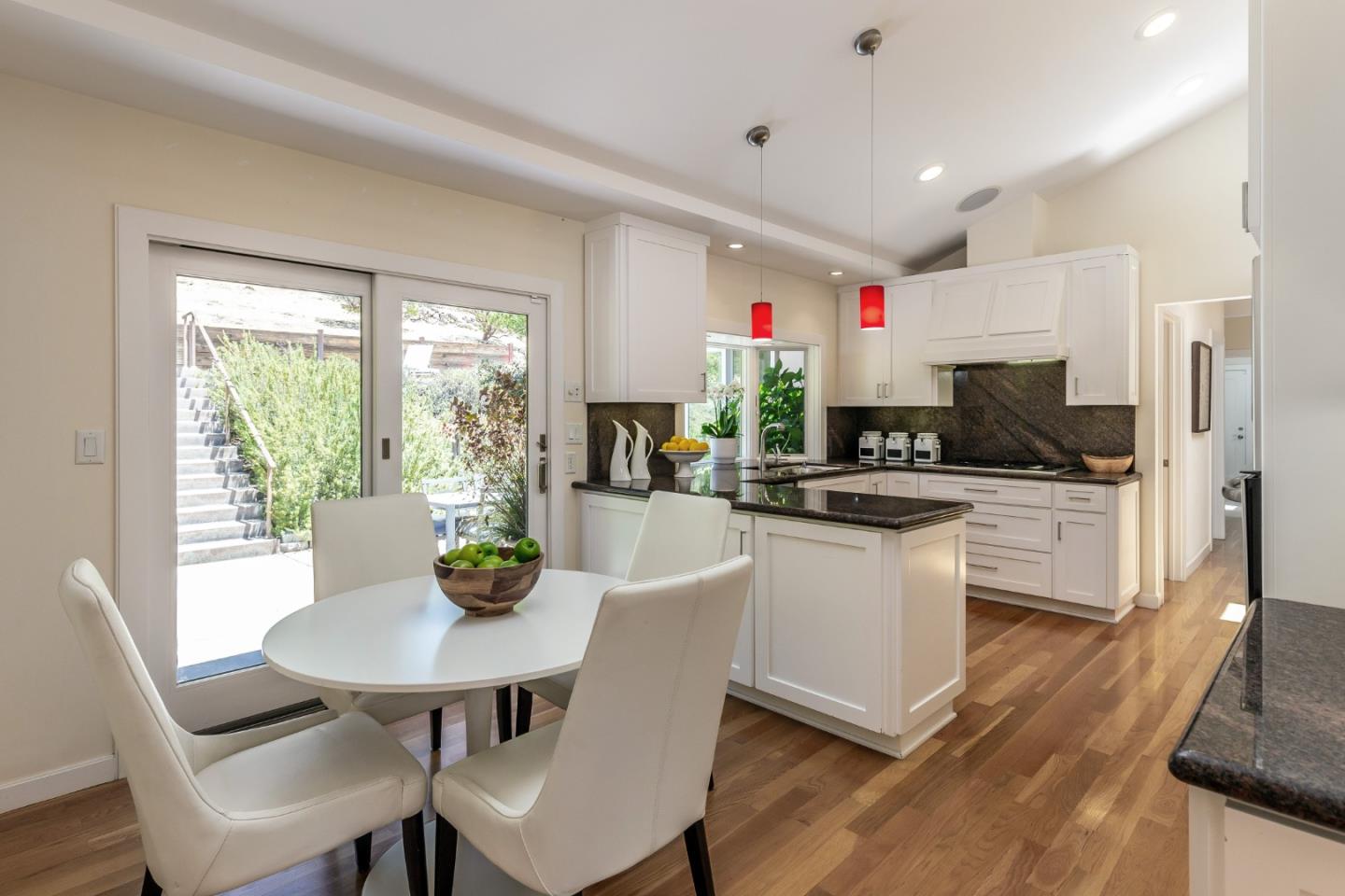 166 Sausal Drive Portola Valley, CA 94028 - Photo 8 of 26 a kitchen with granite countertop white cabinets and stainless steel appliances