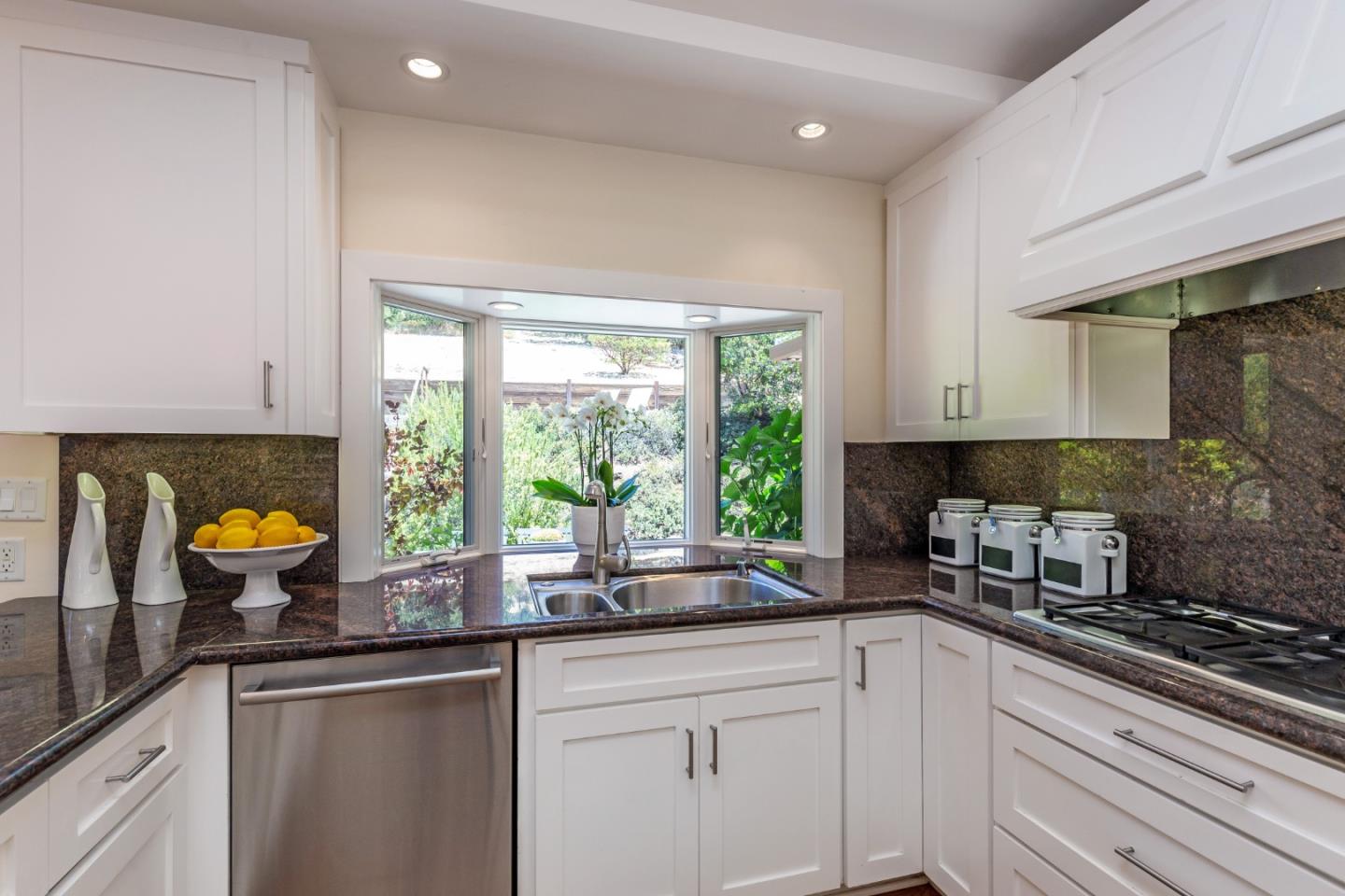 166 Sausal Drive Portola Valley, CA 94028 - Photo 10 of 26 a kitchen with stainless steel appliances a sink a window and cabinets