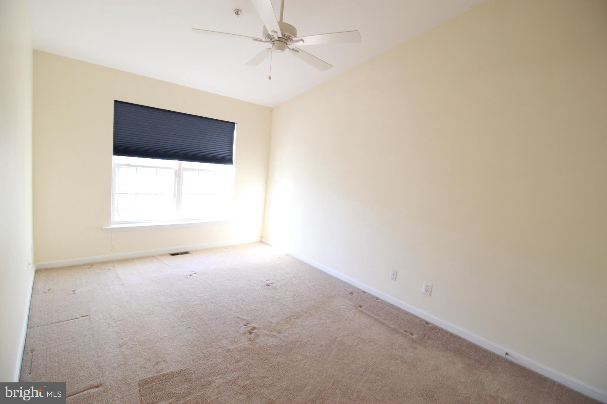 249 Rosebay Court Delran, NJ 08075 - Photo 13 of 16 an empty room with a fan & a window
