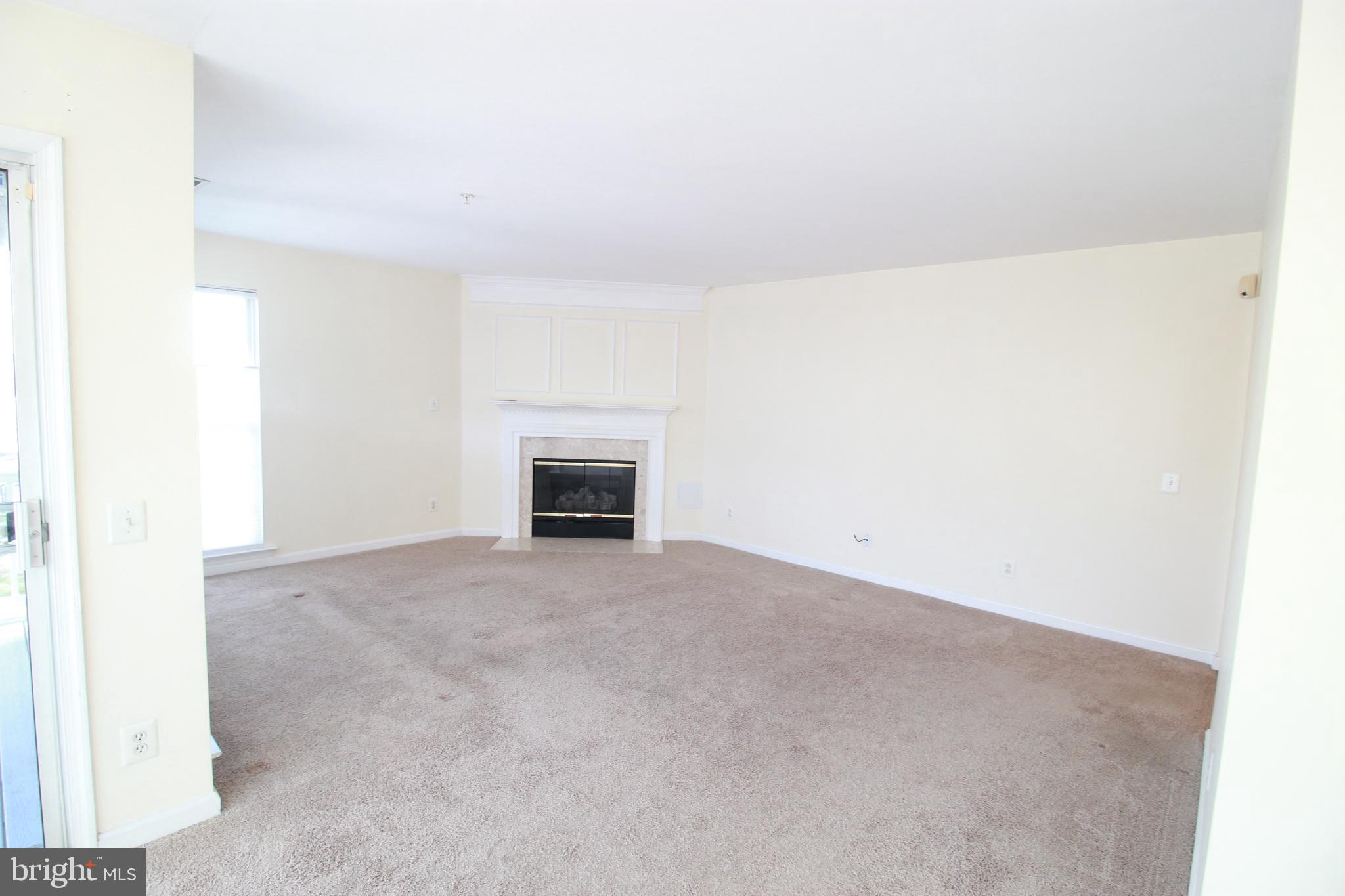 249 Rosebay Court Delran, NJ 08075 - Photo 4 of 16 a view of empty room with a fireplace