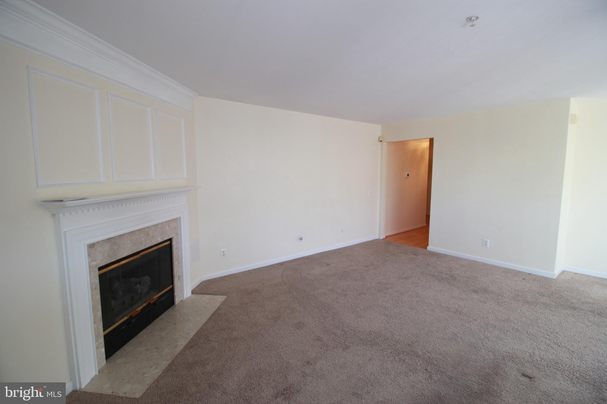 249 Rosebay Court Delran, NJ 08075 - Photo 9 of 16 a view of an empty room with a fireplace