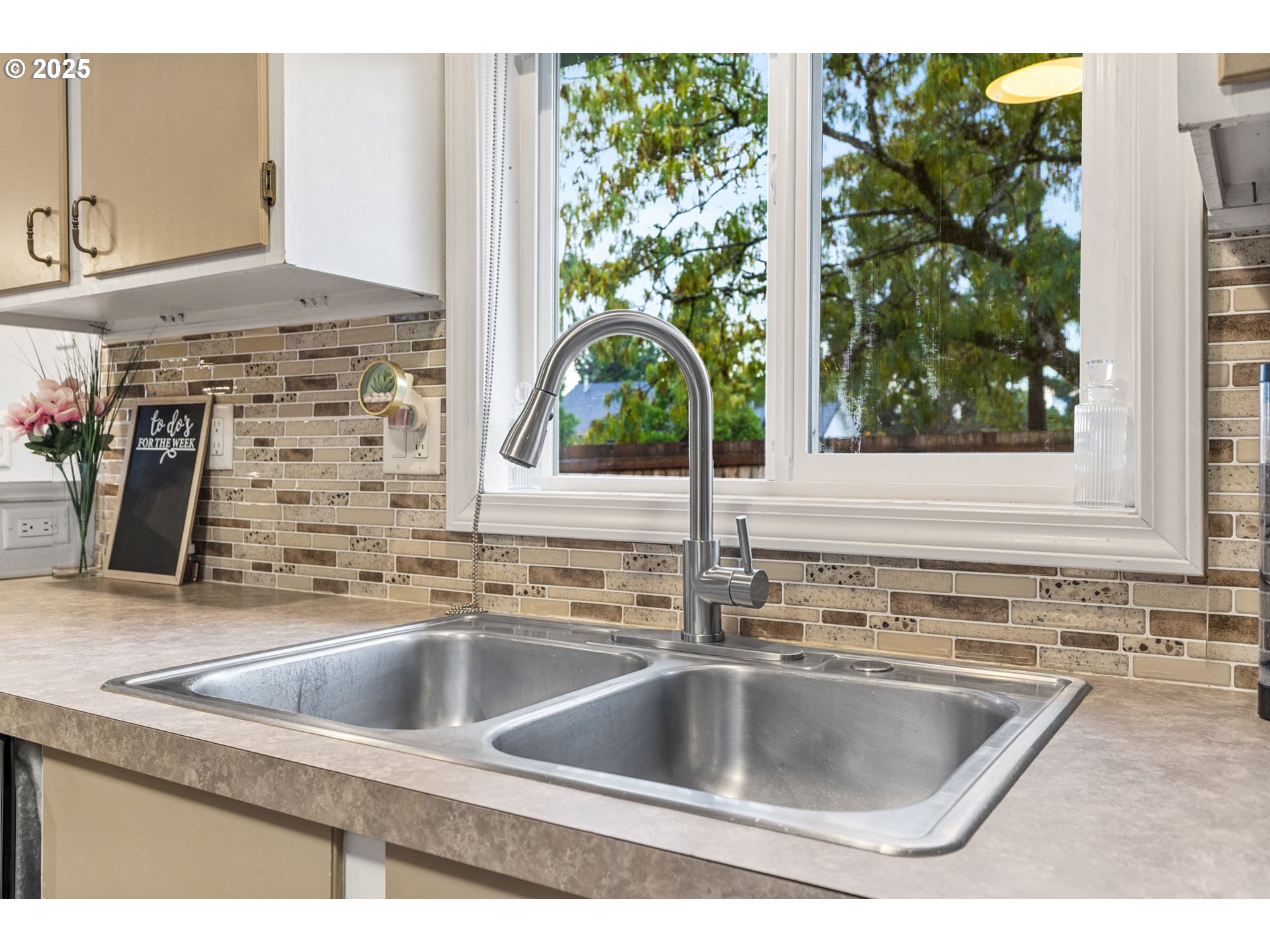 1487 Southwest Fairview Avenue Dallas, OR 97338 - Photo 11 of 34 a kitchen sink with a granite countertop sink and garden
