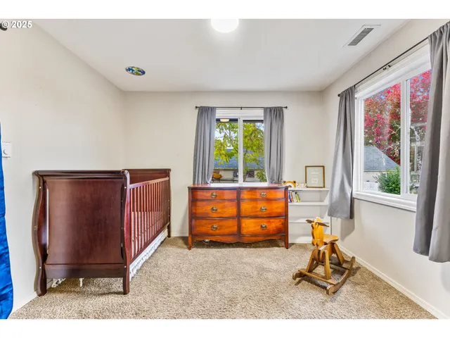 a bedroom with furniture and a window