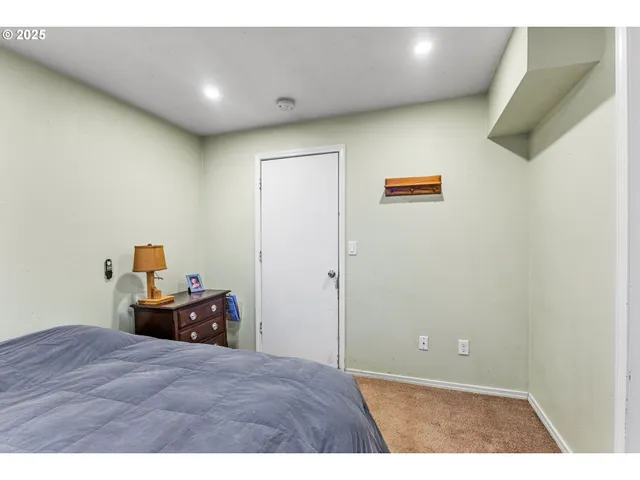 a view of walk in closet with clothes