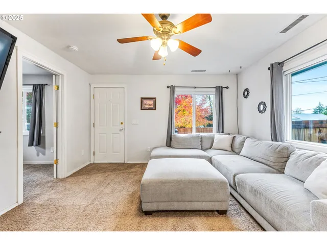 a living room with furniture and window