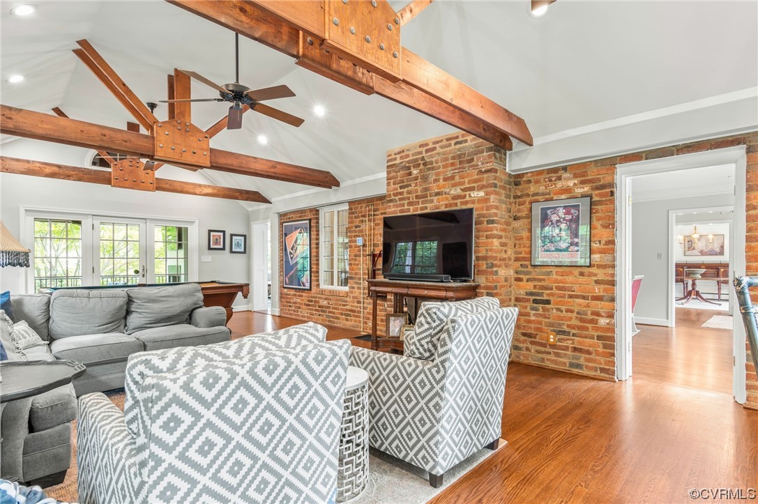 8908 Brieryle Road Henrico, VA 23229 - Photo 11 of 50 a living room with furniture a flat screen tv and a fireplace