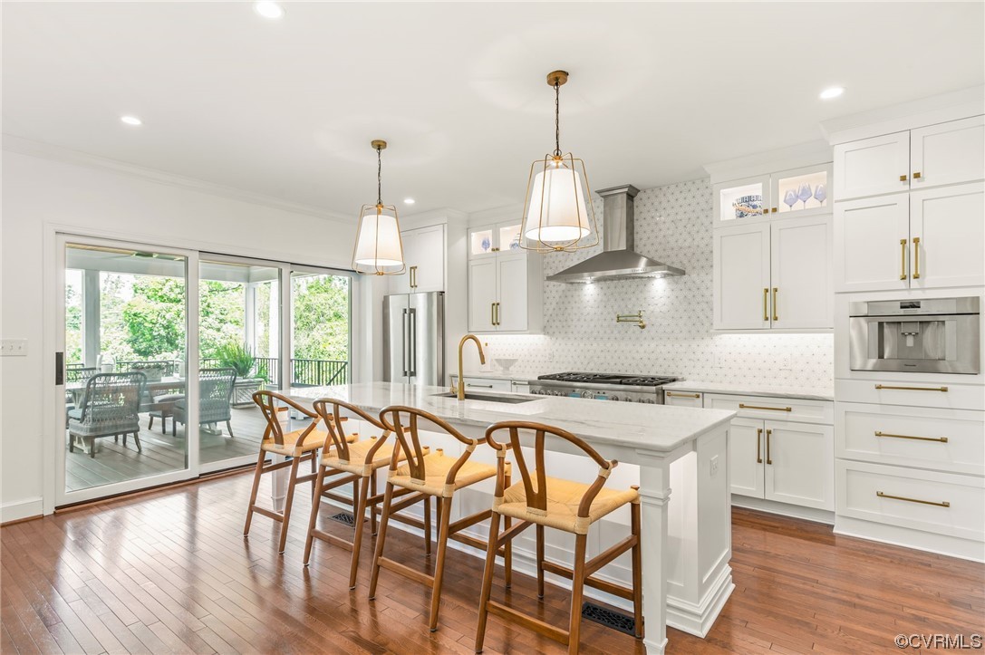 8908 Brieryle Road Henrico, VA 23229 - Photo 15 of 50 a kitchen with stainless steel appliances kitchen island a stove a table and chairs in it