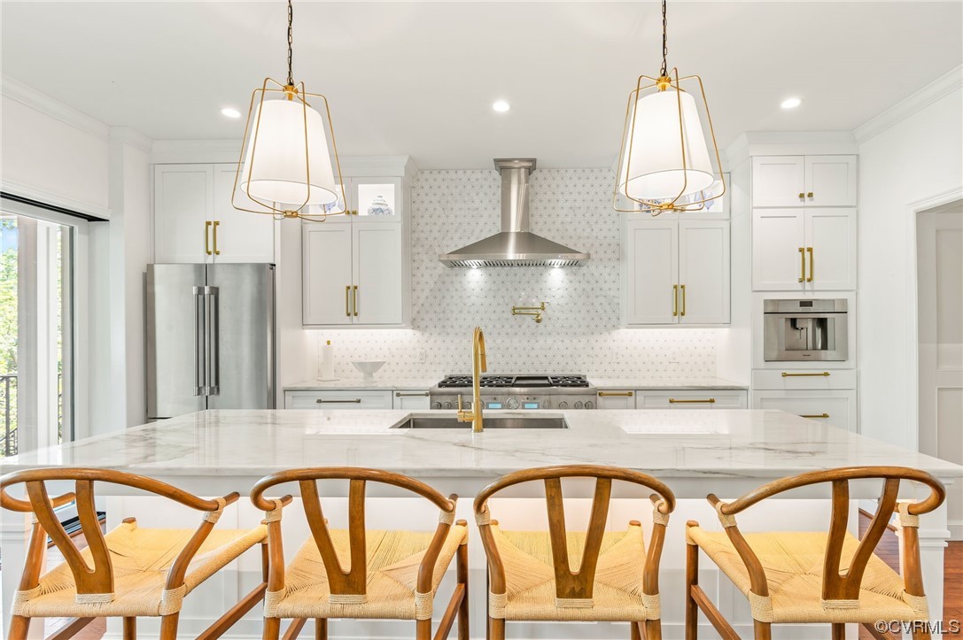 8908 Brieryle Road Henrico, VA 23229 - Photo 16 of 50 a view of a kitchen with furniture and a chandelier