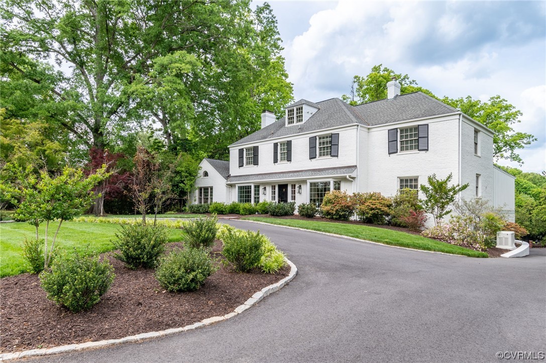 8908 Brieryle Road Henrico, VA 23229 - Photo 2 of 50 a front view of a house with a yard and shrubs