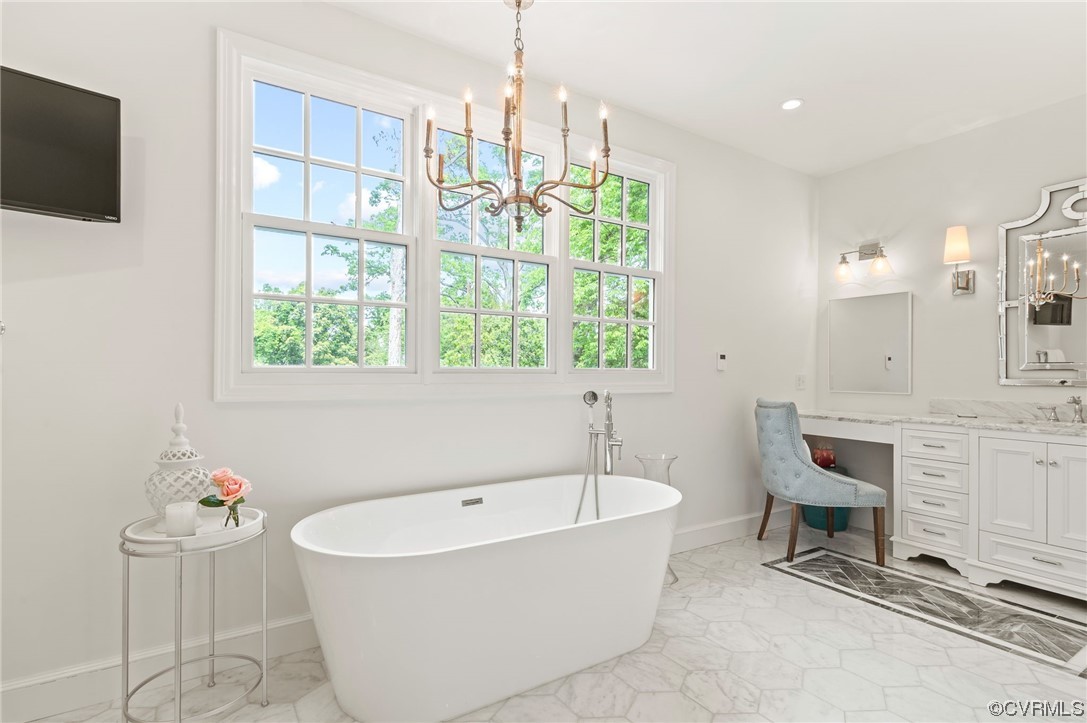 8908 Brieryle Road Henrico, VA 23229 - Photo 26 of 50 a bathroom with a tub sink and mirror