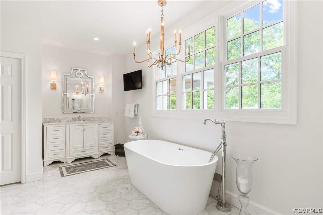 8908 Brieryle Road Henrico, VA 23229 - Photo 27 of 50 a bathroom with a tub sink and mirror