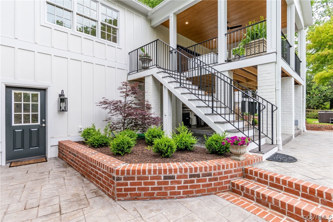 8908 Brieryle Road Henrico, VA 23229 - Photo 43 of 50 a view of a house with large windows and flower plants