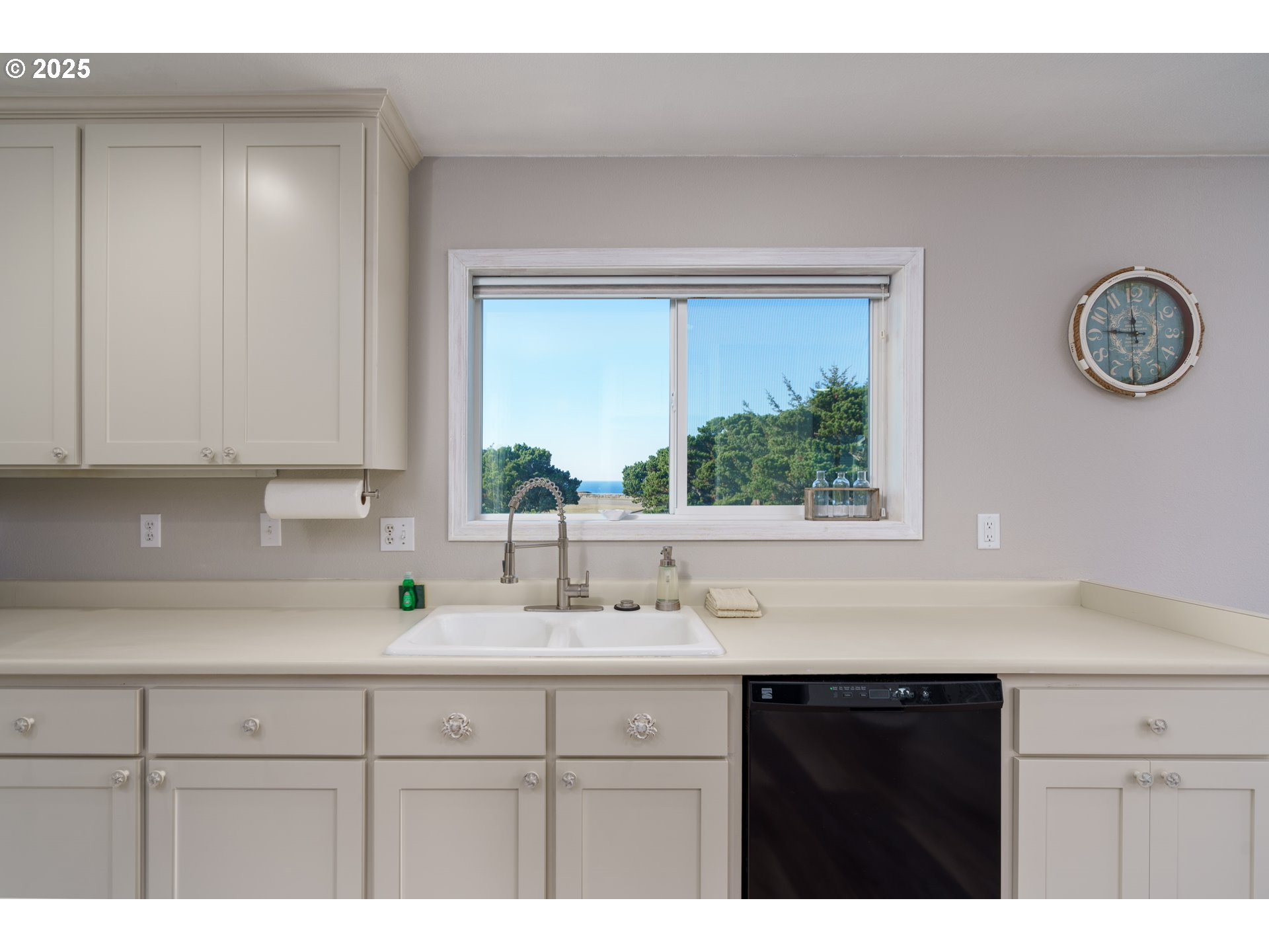 2131 Beach Loop Road Bandon, OR 97411 - Photo 11 of 32 a kitchen with a sink and a window