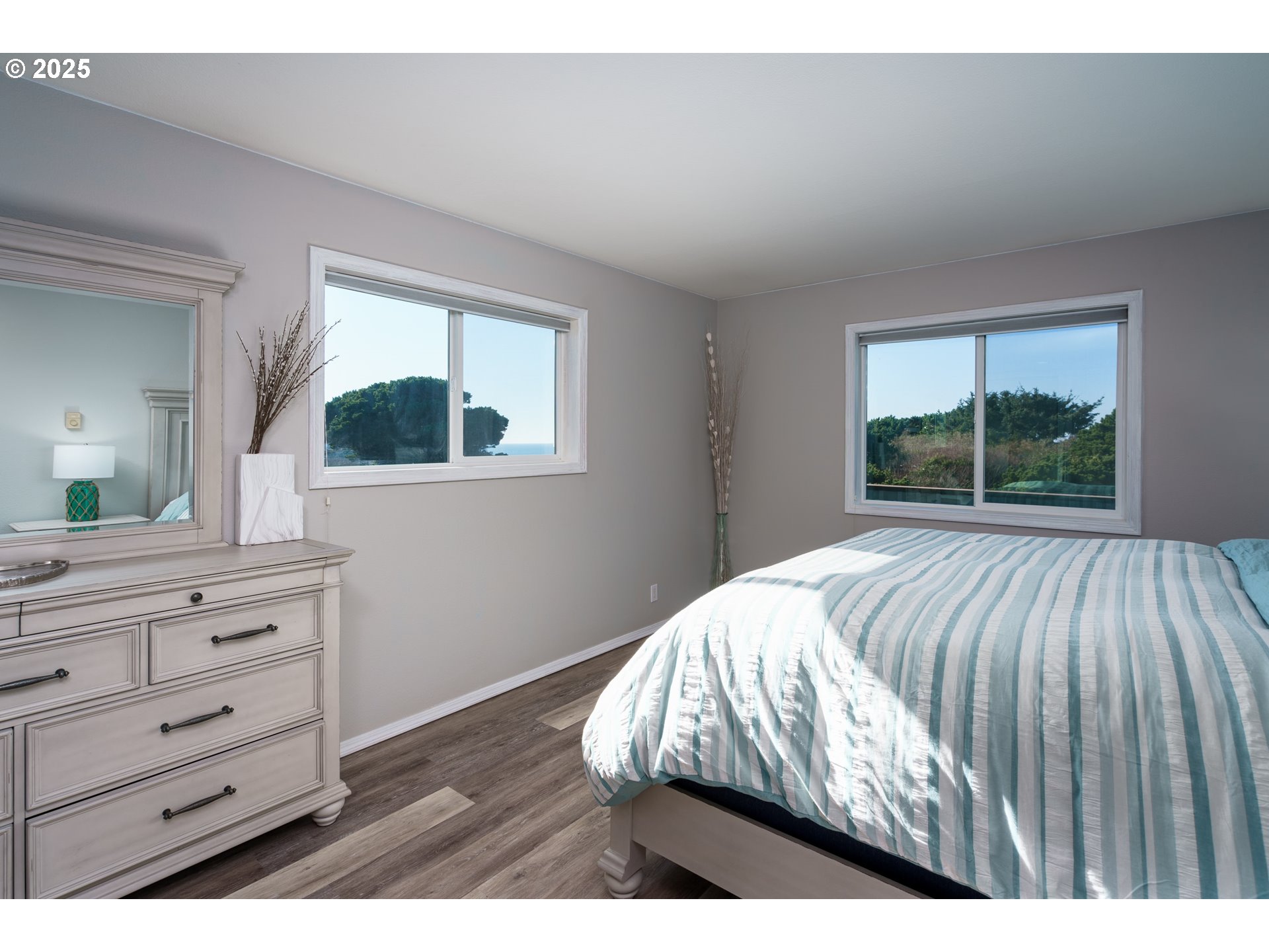 2131 Beach Loop Road Bandon, OR 97411 - Photo 15 of 32 a bedroom with a bed and a dresser