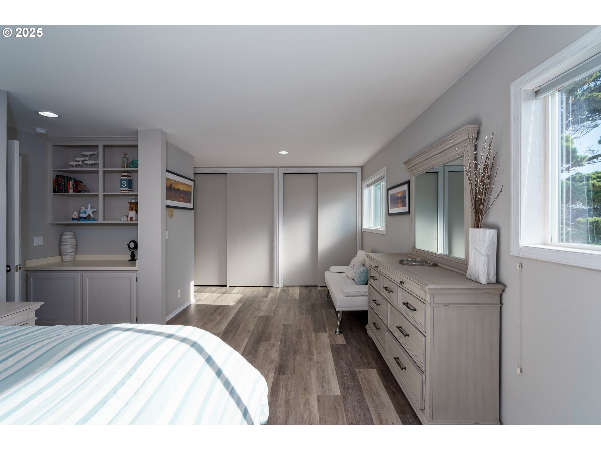 2131 Beach Loop Road Bandon, OR 97411 - Photo 17 of 32 a bedroom with a bed and wooden floor