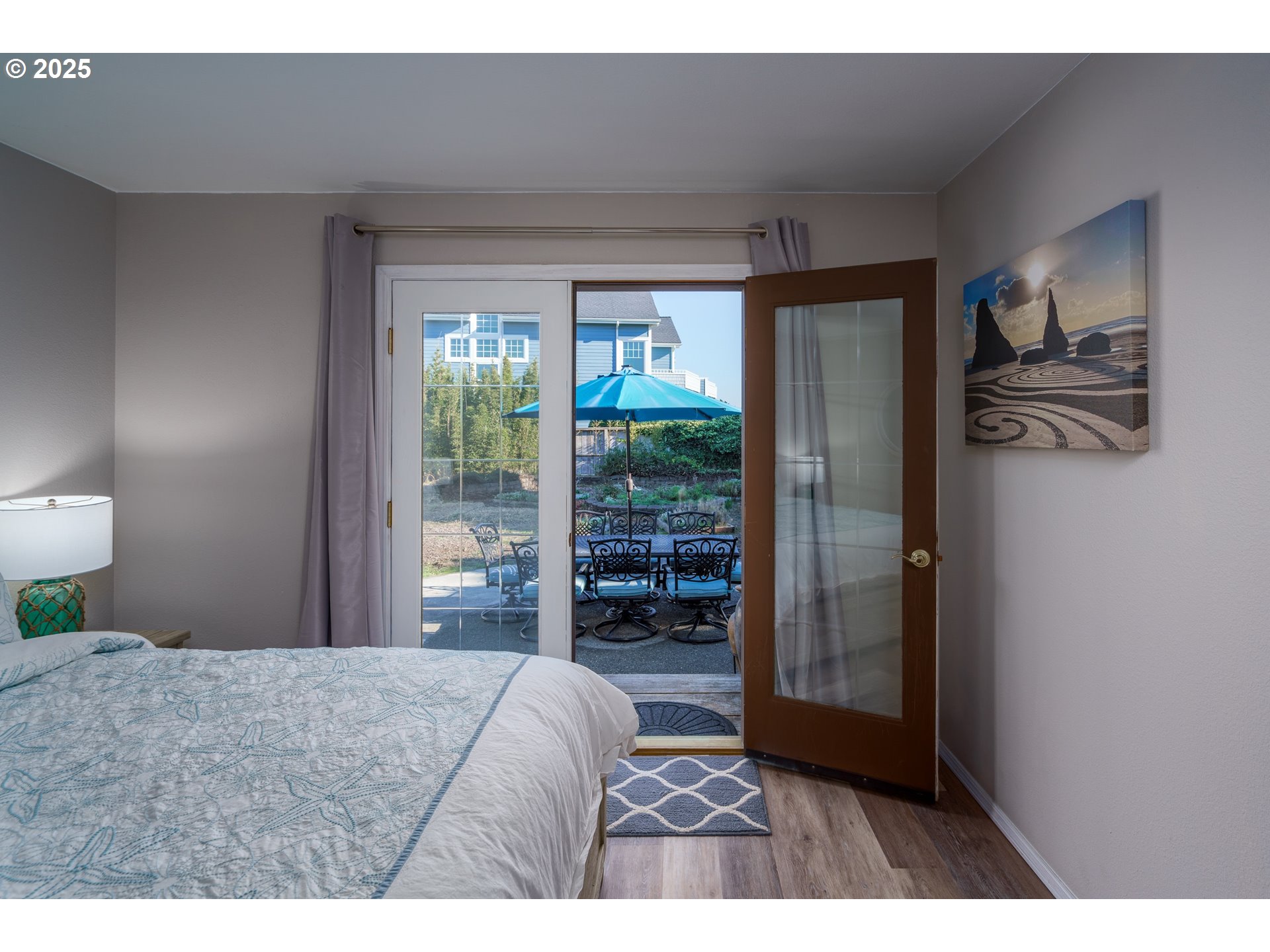 2131 Beach Loop Road Bandon, OR 97411 - Photo 25 of 32 a bedroom with a bed and a large window