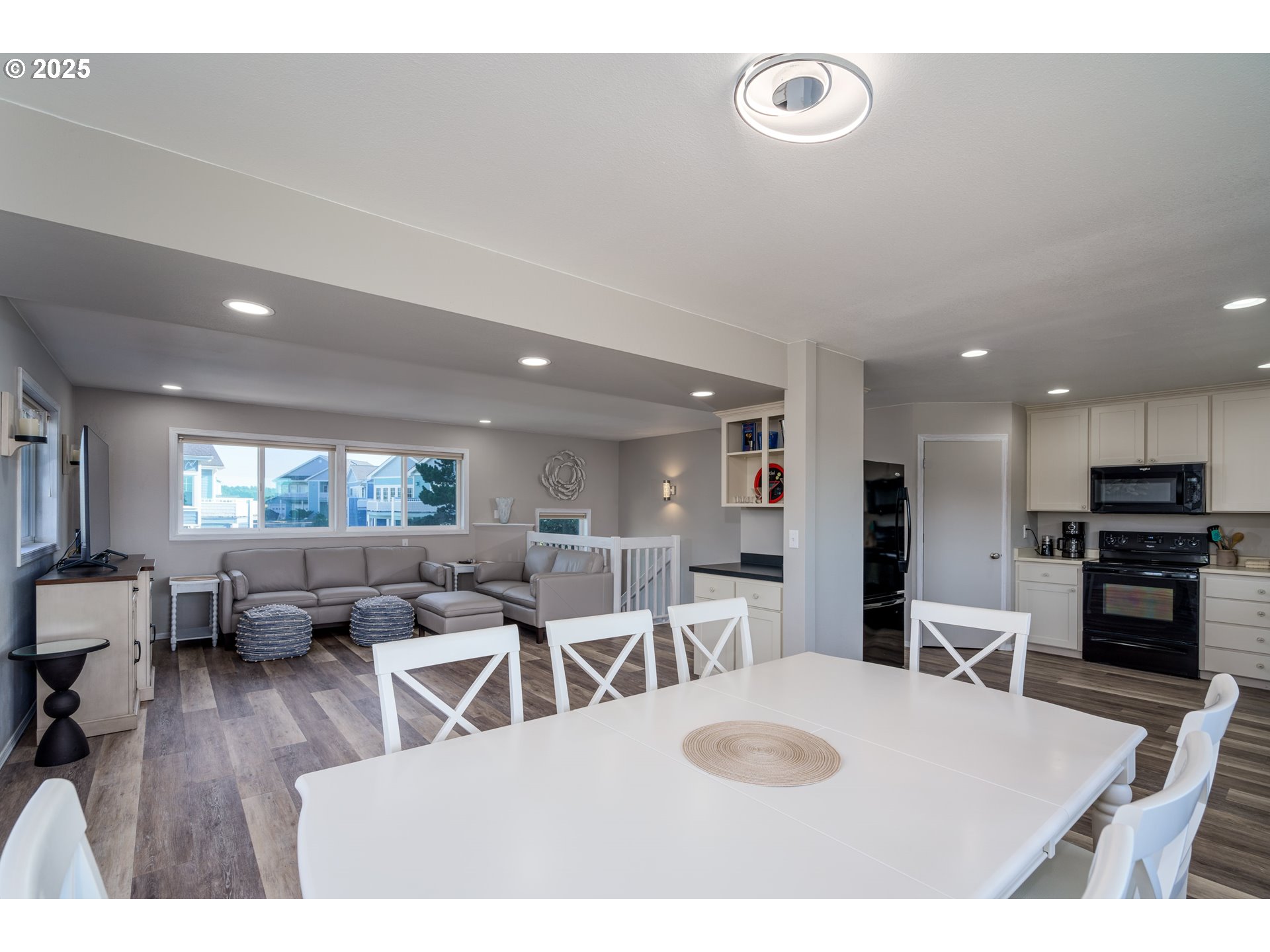 2131 Beach Loop Road Bandon, OR 97411 - Photo 9 of 32 a living room with furniture a large window and wooden floor