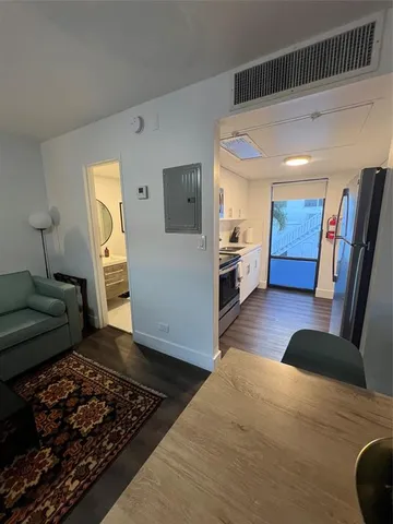 a living room with furniture and a rug