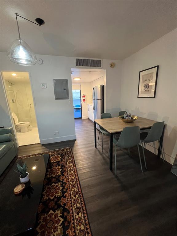 2100 Northeast 33rd Avenue, Unit S A Fort Lauderdale, FL 33305 - Photo 4 of 12 a living room with furniture and a table